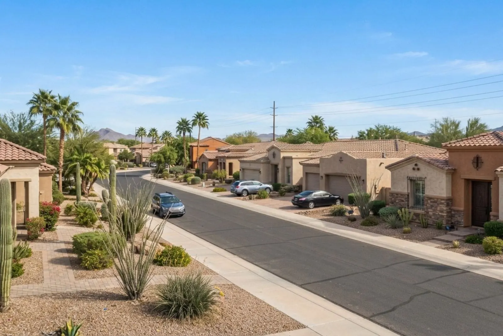 Street of single-story stucco homes with desert landscaping in Surprise, Arizona
