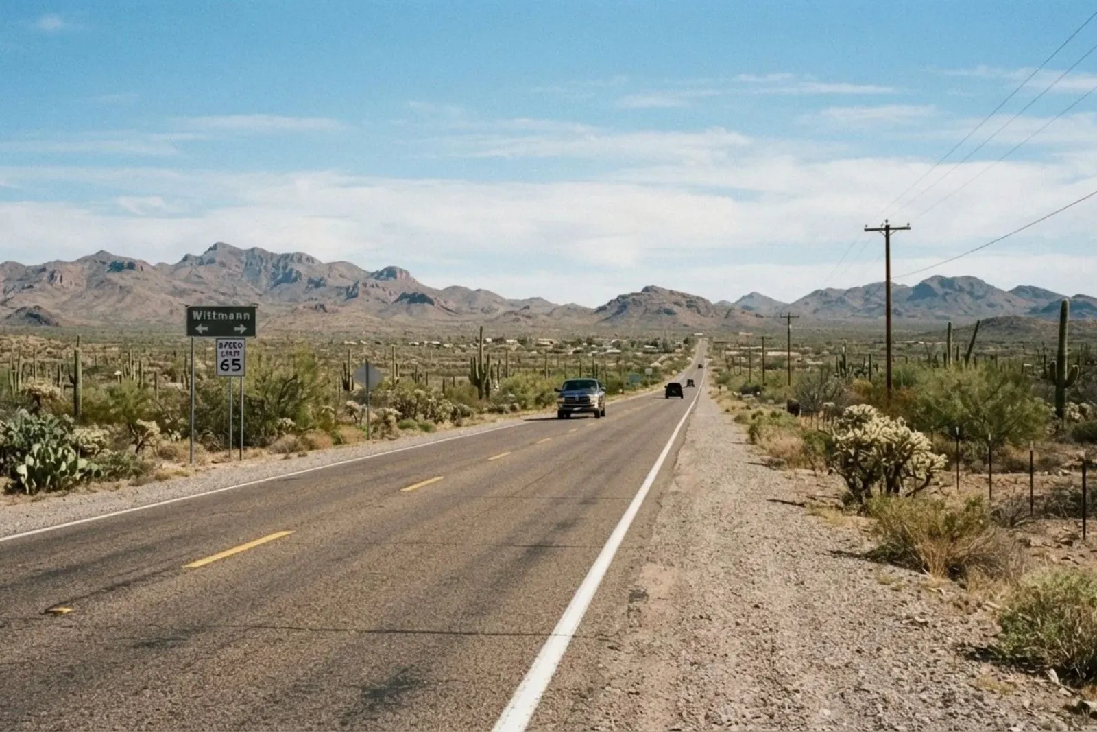 Two-lane highway through open desert near Wittmann, Arizona